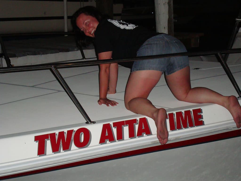 Niki on the deck of a boat at night during an SXT Adventures trip